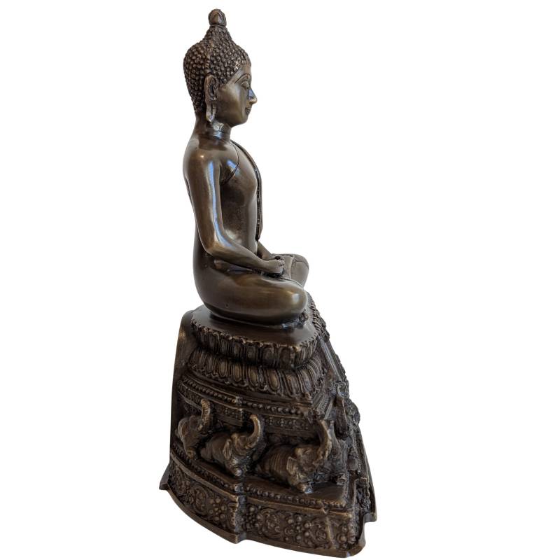 Buddha Bronze sitzend auf Elefantenbasis in Meditation ruhige Ausstrahlung